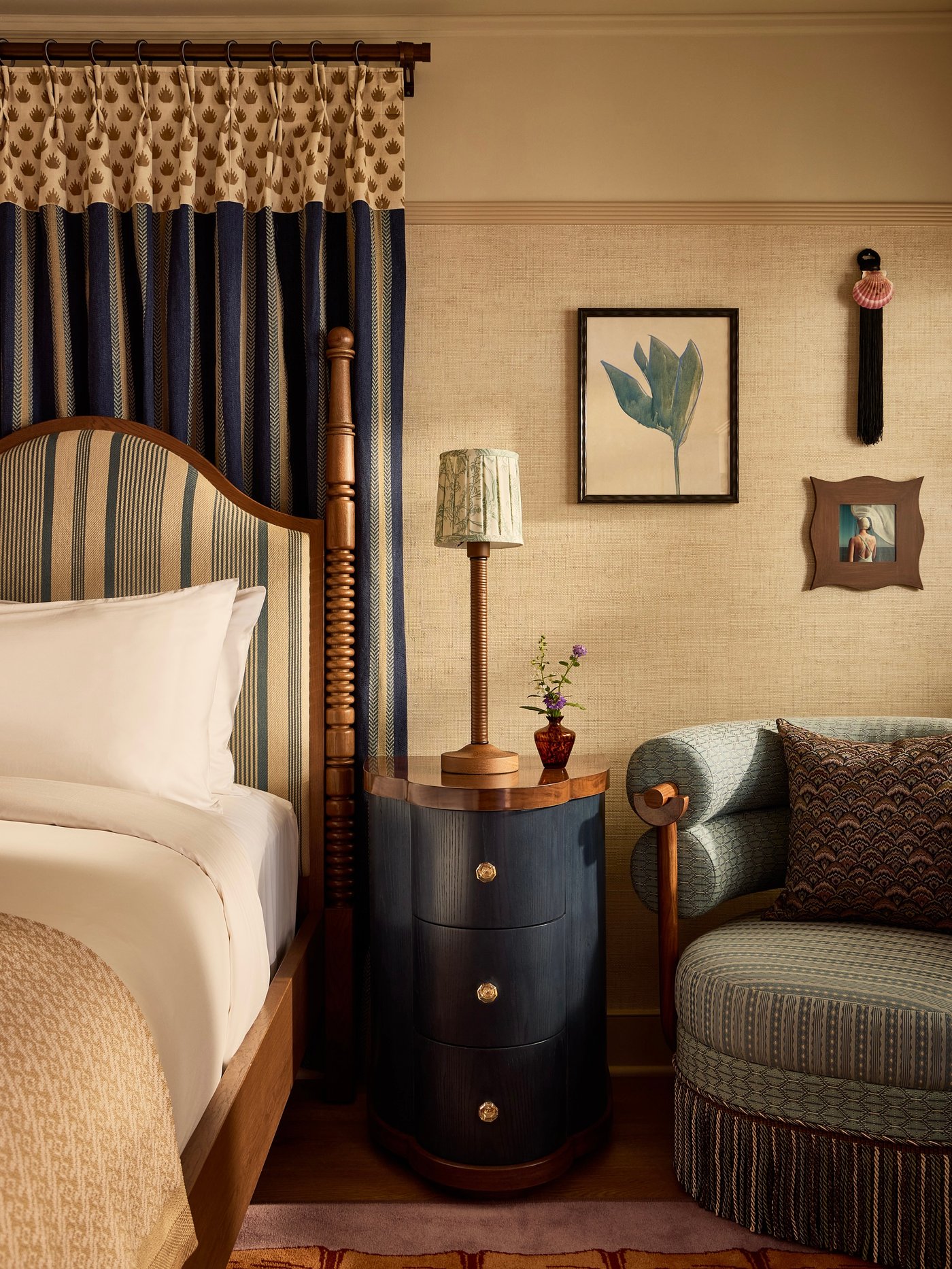 A masterclass in pattern mixing, this guest room balances structured stripes with whimsical fringe and natural textures for a sophisticated yet soulful retreat. The space feels like a private residence of a world traveler, where every corner tells a story through tactile finishes and bespoke craftsmanship.