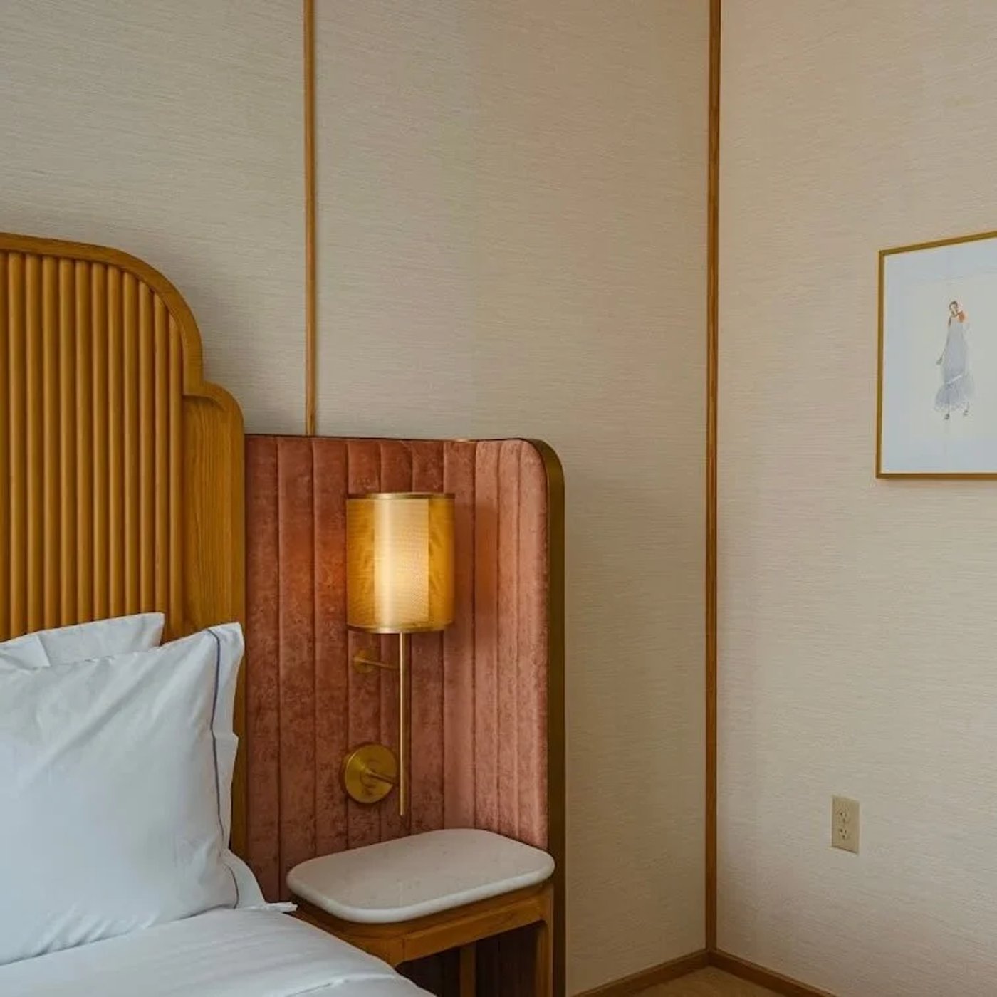 This thoughtfully composed suite blends residential warmth with high-design precision, featuring a palette of forest greens and soft blues against rich oak millwork. The sun-drenched nook invites long mornings of slow living, offering a sophisticated retreat that feels both elevated and deeply personal.
